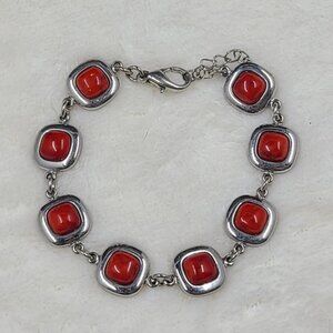 Silver Tone Bracelet With Red Stones